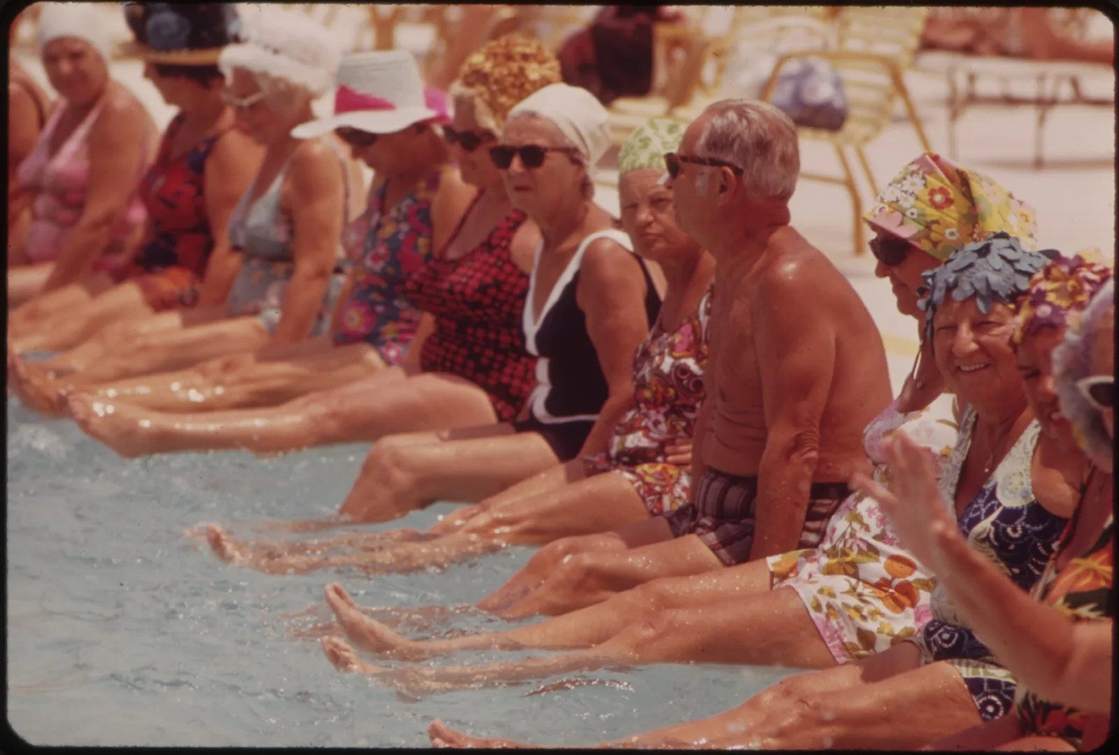 Residents enjoying pool and clubhouse lifestyle like Timber Greens heated pool and spa in New Port Richey