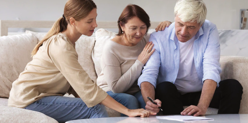 Elderly Couple Signing Paper work